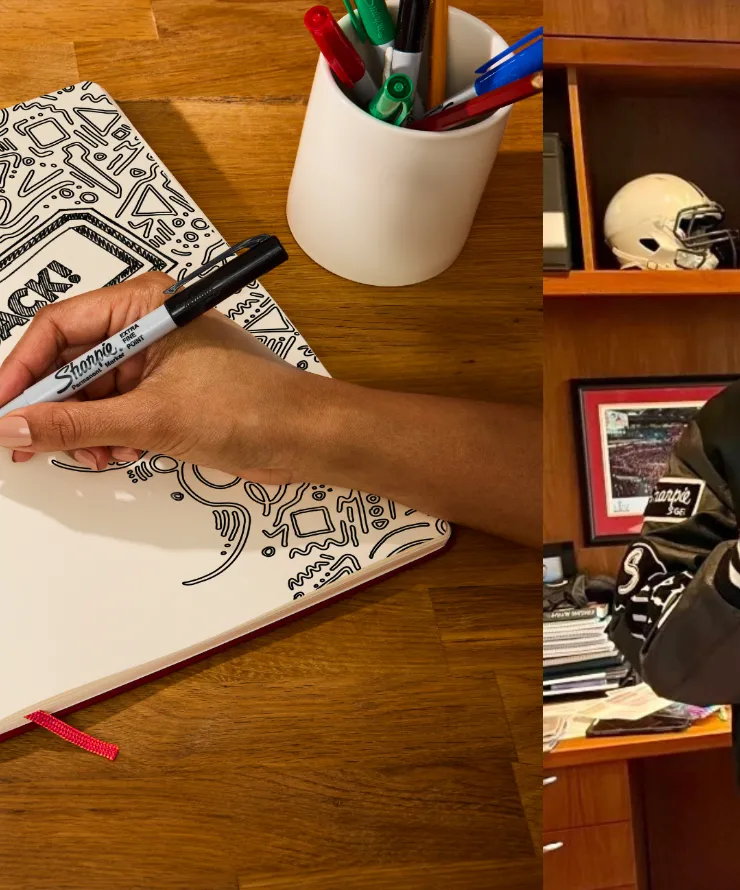 andy reid poses with sharpie pen and person draws and colors with pen